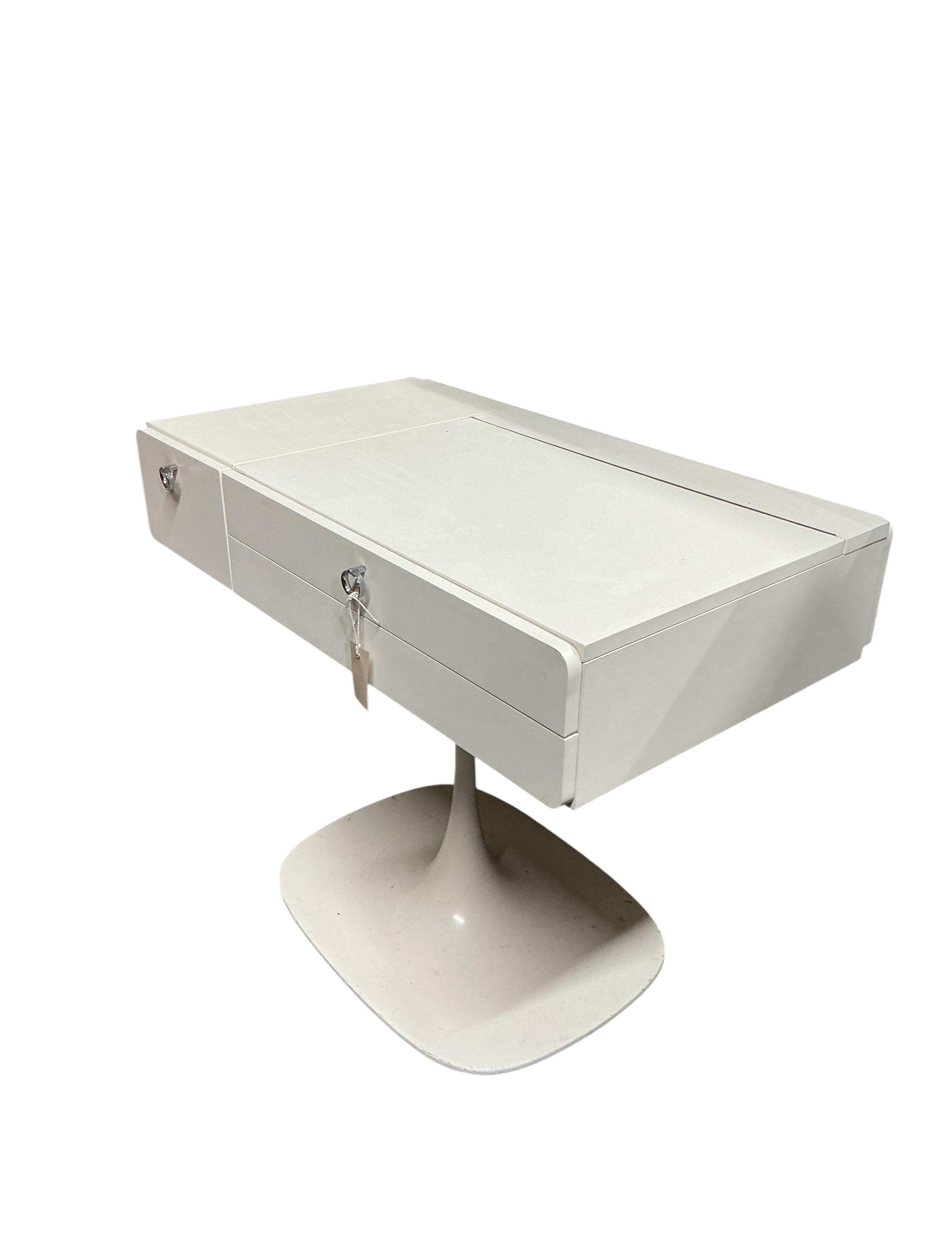 A 1960’s white tulip base dressing table, width 84cm, depth 48cm, height 66cm
